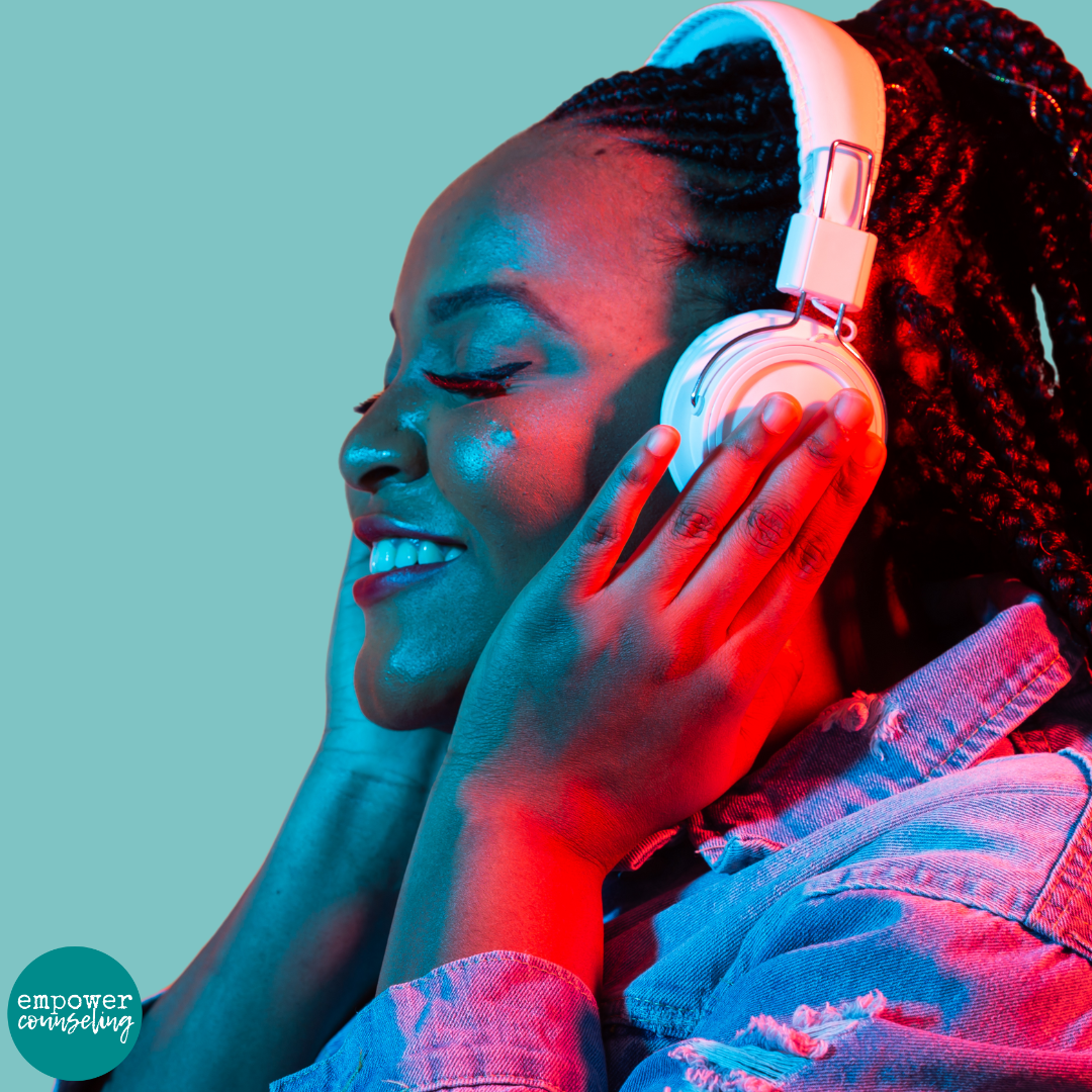 woman, with headphones on demonstrates that sensory regulation can ground you to improve mood and functioning