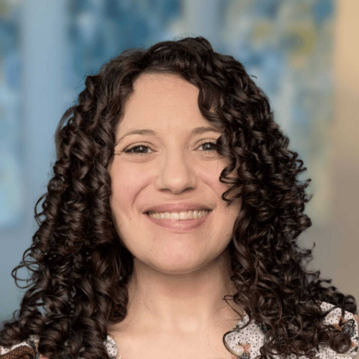 Nadya Clontz, EMDR therapist specializing in chronic illness, trauma, and anxiety, smiling in a professional headshot